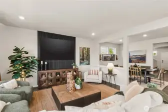 Large great room with plenty of seating space. Actual home is under construction and finishes, colors, and materials may vary. See site agent for details.