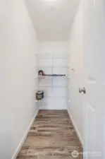 The pantry is a deep storage room off the kitchen.