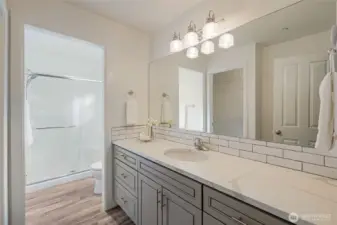 The primary bath has a large vanity with a lot of storage space. There is a nicely updated 3/4 bath that has a walk-in shower.