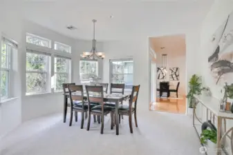 Roomy dining room flooded with light. Great wall space for your special furniture pieces. Open to main living area and kitchen.