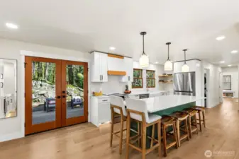 Fully updated island kitchen with quartz countertops and modern finishes.