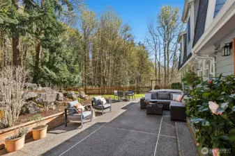 The backyard offers a retreat-like setting surrounded by nature.