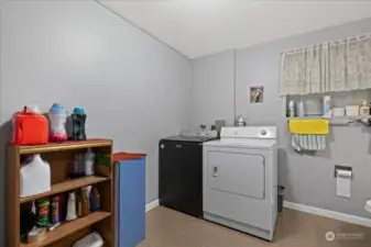 Laundry room on lover level with a full bathroom