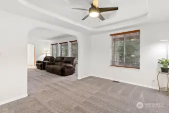 This combination living/dining room has a wall of windows with wonderful natural light!