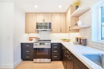 Two-toned kitchen cabinets with classic tile backsplash keeps that clean, fresh look.