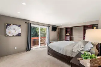 Upper level primary bedroom with private backyard, balcony access.