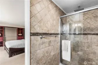 Beautifully tiled, primary bathroom.