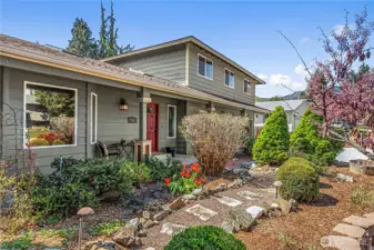Well-maintained front yard with mature landscaping.