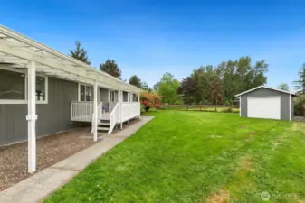 Back yard shed / 1 car garage offers ample storage space.