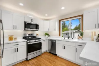 Brand new cabinets, quartz counters and appliances! Plus over and under mount lighting.