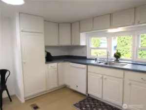 SPACIOUS KITCHEN W/ ADDED STORAGE.