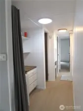 NEW PAINT, TRIM AND LIGHTING, HALLWAY TO BEDROOMS & BATH.