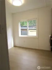 SPARE BEDROOM WINDOW FACES SOUTH & OVER LOOKS CARPORT & BACKYARD.