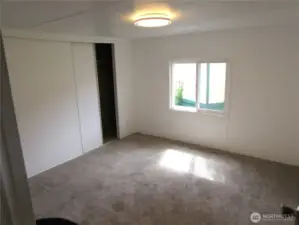 PRIMARY BEDROOM W/ NEW LIGHTING,CARPET, TRIM & PAINT.