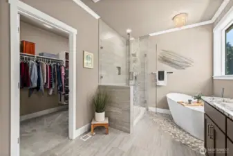 This is a spacious walk-in closet for his and hers!