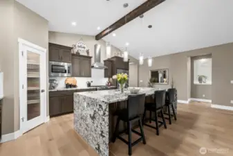 Top quality cabinets, stainless appliances and pendant lighting in this hub-of-the-home kitchen