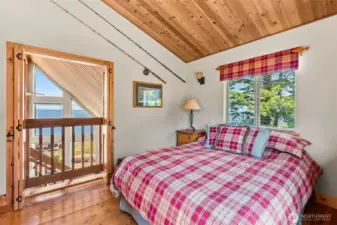 Bifold doors allow for the bay views from the bedroom