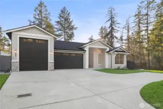 This elegant single-level home features an abundance of parking both inside and out.