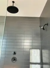 This Large Shower is appointed with a Rain Shower Head and a wall Shower head