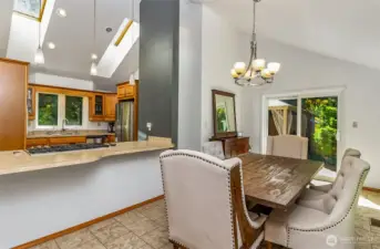 The large breakfast bar is open and friendly. Two skylights in the kitchen bring in welcome natural light.