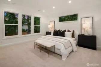 Designer primary suite with five-piece bath with heated floors