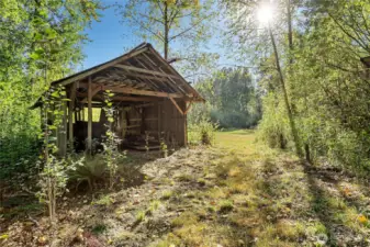 Convert this to a hang out space next to the meadow. A huge campsite!!