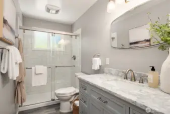 Refreshed main bathroom with crisp subway tile and marble counter top.
