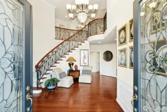 A grand entry welcomes you with timeless elegance, highlighted by custom-designed ironwork railing.