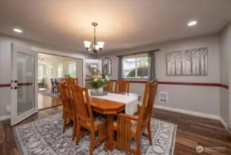 This stunning dinning room has room to seat 20 people if needed.  The dinning room opes to the sunroom.