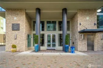 The elegant entrance of the Baker Building at Point Ruston showcases modern design and secure building access. Residents appreciate the well-maintained exterior, stylish architectural details, and the convenience of being moments from Ruston Way’s waterfront, parks, and local amenities.