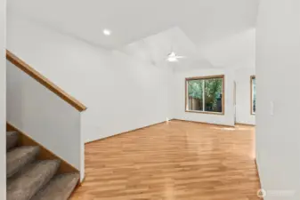 Carpeted staircase off living room walkway leads up to all 3 upstairs bedrooms.
