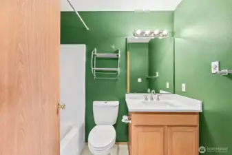 Full bathroom on upper level, vinyl flooring and updated vanity countertop, undermount sink and fixtures.