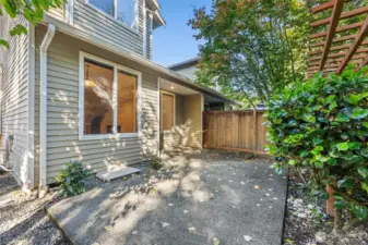 Backyard with large patio - fully fenced, low maintenance landscaping.