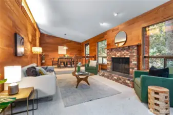 Living room with vaulted ceilings and fireplace