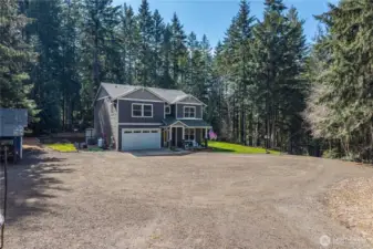 TONS of parking - Large gravel driveway plenty of space for RV, boat and all your toys or hosting large parties. Concrete pad leads to the 2-car garage. Plenty of turnaround space.