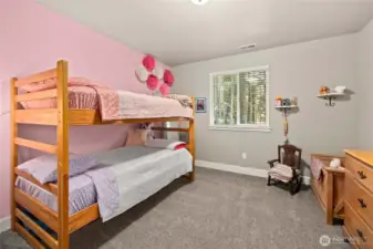 Spacious bedroom 2 with wall-to-wall carpet.