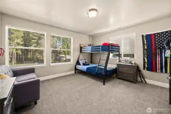 Large bedroom 3 with plenty of natural light from the large windows.