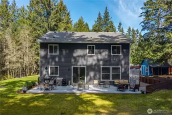 Large deck spans the width of the rear of the house. Plenty of space for outside dining, grilling tools, lounging set and more.