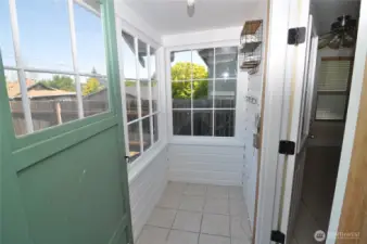 Tiny sunny enclosed porch would be great for plants!