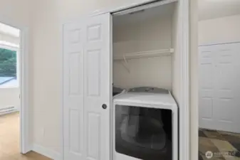 Almost new large capacity water and dryer. Front door to right of frame