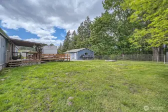 Lots of room to play or entertain! The ramp from the deck to the RV can stay or be removed. It simply provides access from the trailer to the house with no stairs.