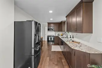 Granite countertops, beautiful cabinetry, and a great appliance package.