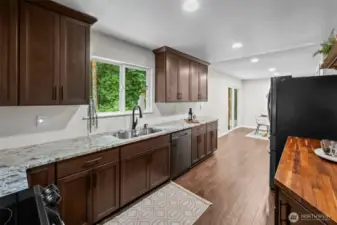 With our backs to the 3/4 bathroom and garage.
