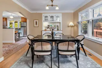 From the dining room looking into the kitchen. The original sideboard makes setting the table easy and gives you extra cabinet space.