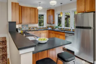 7344 Keen Way N has a semi open floor plan. Friends and family can hang out while you cook but if you haven't finished up dishes, they aren't front and center.