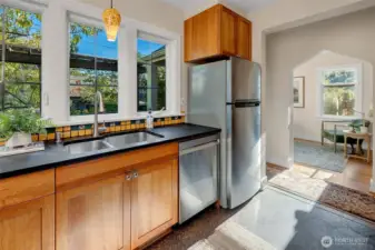 Enjoy a view of birds in the trees and raised beds while washing up.