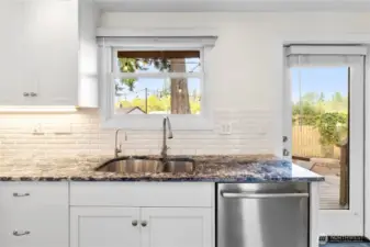 Lovely view of the deck and yard at the sink!