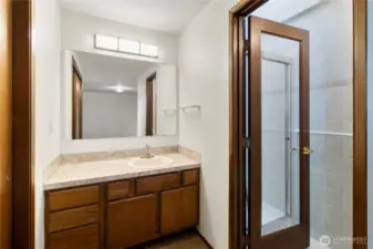The ensuite bath has a separate room for the shower and toilet.