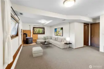 The large family room has a wood stove to warm you on chilly nights.  Plenty of room for multiple separate activities - games, reading or sipping hot chocolate by the stove!