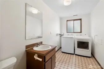 The huge laundry room also containes the downstairs half bath.l